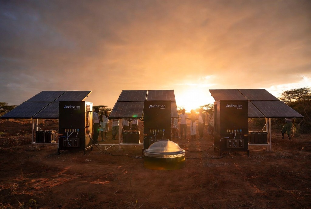Aetherion solar-powered water infrastructure with community members at sunset in rural Eswatini